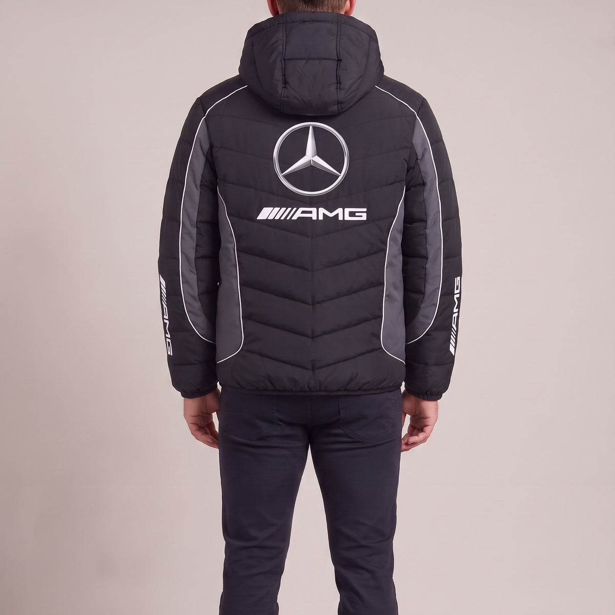 Man wearing the Mercedes-AMG heated puffer jacket, back view